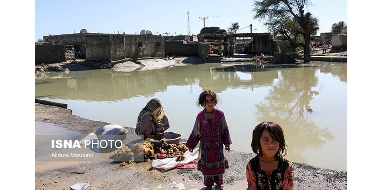 Shivering in the winter cold, three girls describe their lives after the flood
